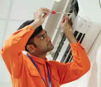 indian-man-setting-up-air-conditioner-RJ9VBA6